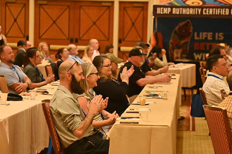 conference attendees clapping during presentation